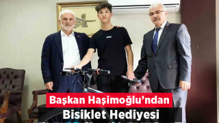 Başkan Haşimoğlu bisiklet hediye etti.